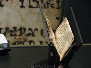 Photo Credit: Anav Silverman, Tazpit News Agency / The 1,200 year-old ancient prayer book on display in the Bible Lands Museum. 