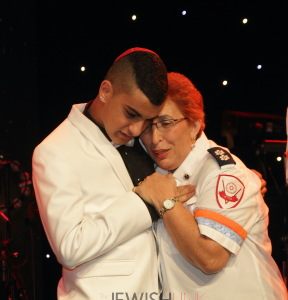 AFMDA-Yarin-Levy-hugs-Neomi-Zvi-the-MDA-medic-who-saved-his-life.-Photo-by-Michelle-Mivzari