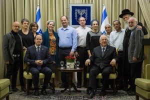Photo #2: Jerusalem Mayor Nir Barkat (fifth from left) and Israel’s President Reuven Rivlin (sitting right) gather with the families of the three boys who were kidnapped and murdered by Hamas in the West Bank last year.