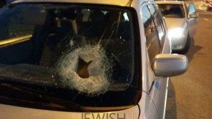  Stone penetration hole on a car's front window. Photos credit: Tazpit News Agency. 