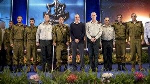 Sahar Elbaz award: IDF Chief of Staff Benny Gantz (6R) and Defense Minister Moshe Boogie Yaalon (7R) with Sahar Elbaz (4L) and other Israeli soldiers during a grant decorations, citations ceremony at the Palmachim Airbase on Feb 2, 2015. Photo by IDF Spokesperson