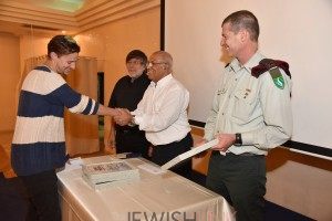 Photo Credit: AWIS PR /  Daniel Wein shaking hands with AWIS chairman Brig. Gen. (res.) Avigdor Kahalani after he was announced the winner of the soldiers' art competition.  
