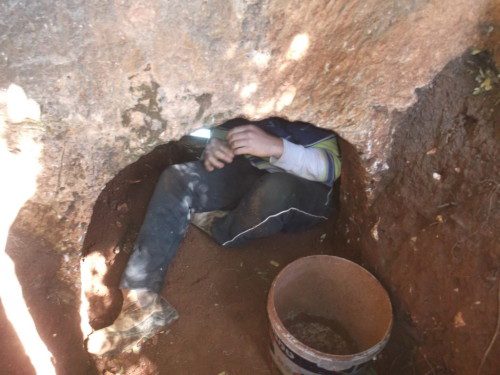 (photo description and credit: one of the grave robbers com?ng out of the self dug cave / IAA anti-theft Task Force) 