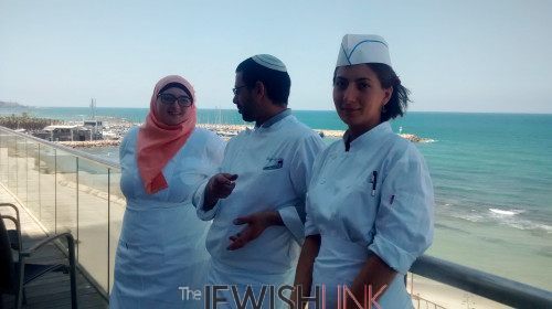 : Culinary students, Roaa Msarwa and Alina Khalaman with their teacher, Oneg Etz Chaim (center) at the Tel Aviv Hilton Hotel.