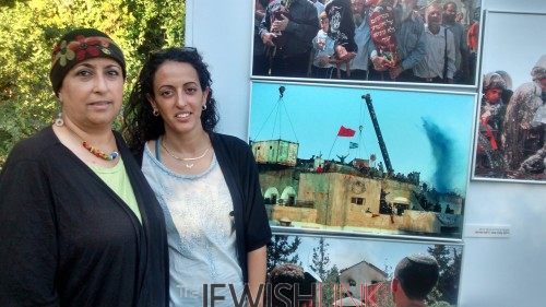  Orna and Hodaya Giat originally from Kfar Darom stand near photos of their Gush Katif community at a photography exhibition at an event marking 10 years to the Disengagement at the President's Residence in Jerusalem last week.  