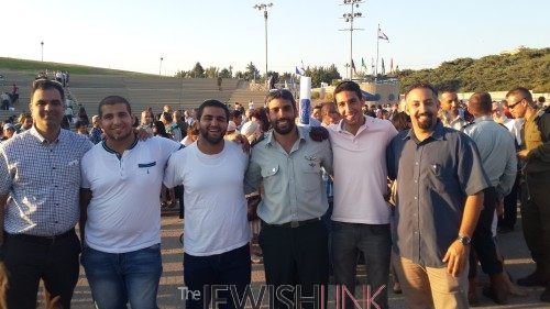 Rabbi Yair Chetboun (in uniform) with his students, Rabbi Pini Haziz (right) and Rabbi Lior Levi, a 12th grade teacher (left)