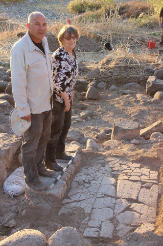 Haifa University Archeologits at the Discovery Site Dr. Haim Cohen (Left) and Professor Michal Artzy (Right) standing next to their discovery. Courtesy of the University of Haifa
